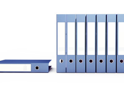 Row of binders on a white background, showing research.